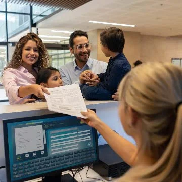 Hospital receptionist collecting patient information.