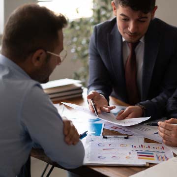 Two accounts receivable analysts discussing.
